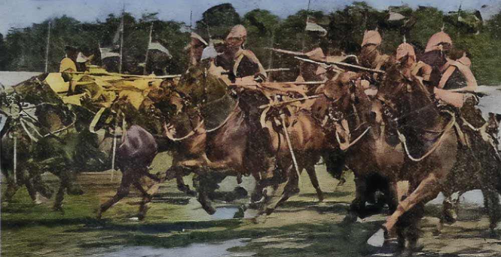 The Queen's Bays (maybe including those) stationed at Willems Cavalry Barracks performing a charge.